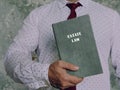 Lawyer holds ESTATE LAW book. AnÃÂ estate, inÃÂ common law, is theÃÂ net worthÃÂ of a person at any point in time alive or dead